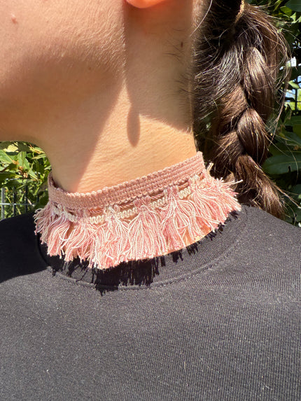 PASSAMANERIA CON FRANGE ROSA